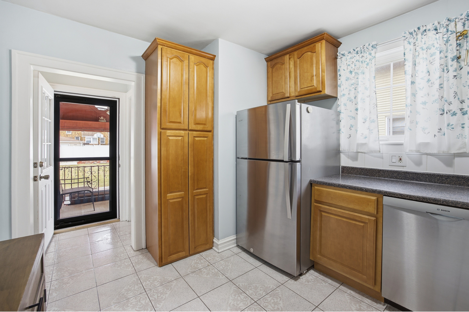 2557 Oak Street River Grove, IL 60171 - Photo 8 of 42 a kitchen with stainless steel appliances granite countertop a refrigerator and a sink
