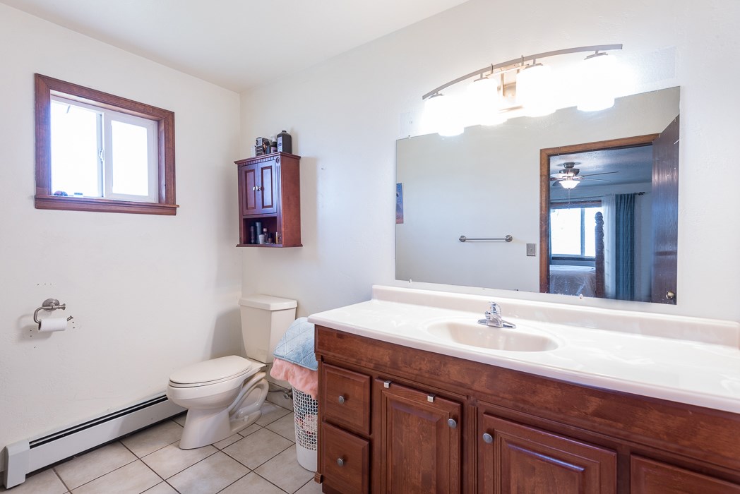 936 22 Road Grand Junction, CO 81505 - Photo 36 of 42 a bathroom with a sink and a mirror