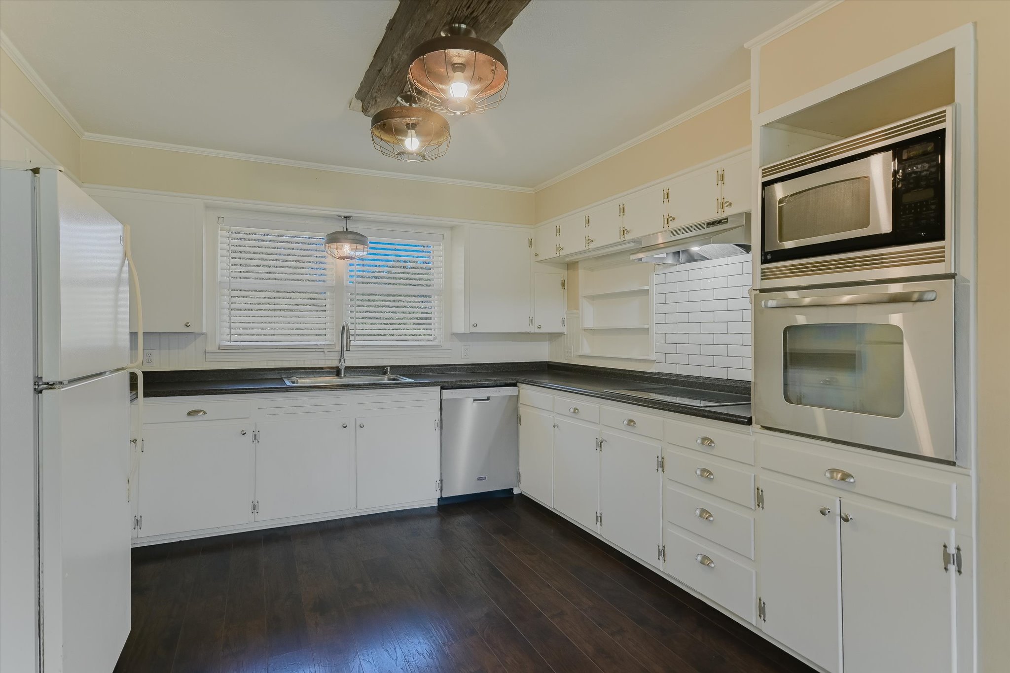 5421 Purgatory Road San Marcos, TX 78666 - Photo 8 of 38 a kitchen with granite countertop white cabinets white stainless steel appliances and a sink