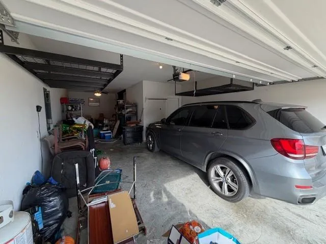 a car and bike parked in a garage