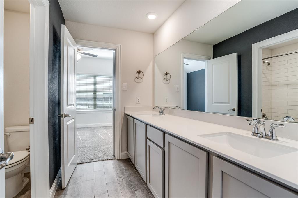 10421 Table Blf Street Aubrey, TX 76227 - Photo 15 of 25 a spacious bathroom with a double vanity sink and a mirror