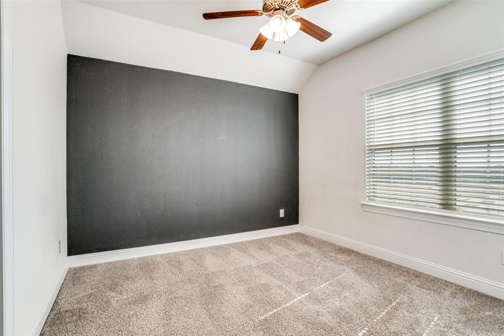 10421 Table Blf Street Aubrey, TX 76227 - Photo 16 of 25 an empty room with windows and fan
