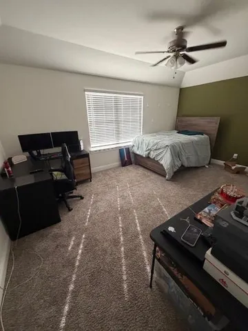 a bedroom with a bed furniture and a window