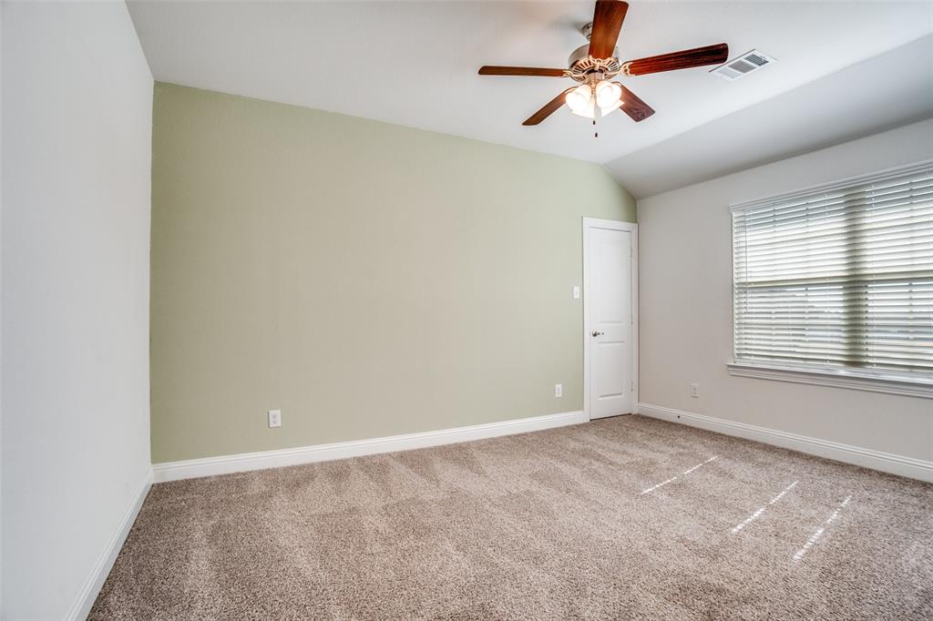 10421 Table Blf Street Aubrey, TX 76227 - Photo 18 of 25 a view of an empty room with a window
