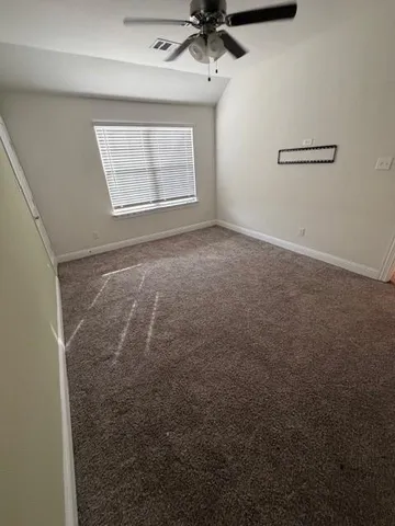 a view of a hallway and a livingroom