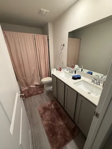 a view of a livingroom with a ceiling fan and window
