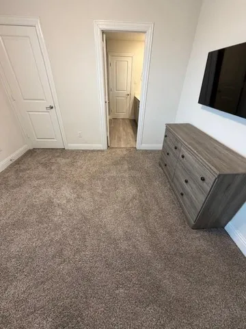 a bathroom with a double vanity sink and mirror