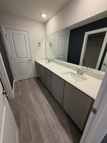 en empty room with windows and fan