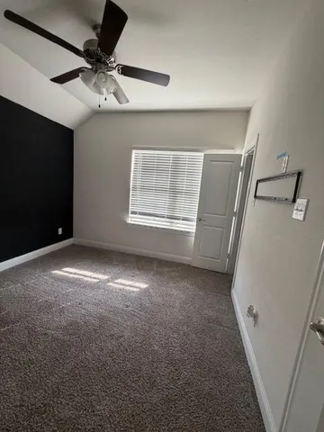 a room with gym equipment and a large window