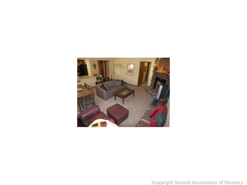 800 Copper Road, Unit 272 Copper Mountain, CO 80443 - Photo 10 of 12 a living room with furniture and a table