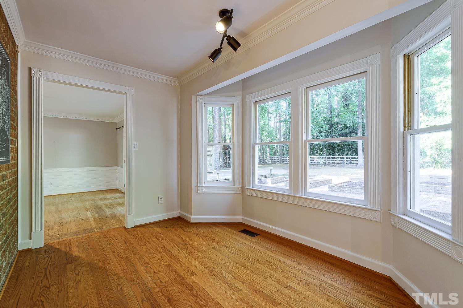 11709 Old Creedmoor Road Raleigh, NC 27613 - Photo 3 of 16 a view of an empty room with a window