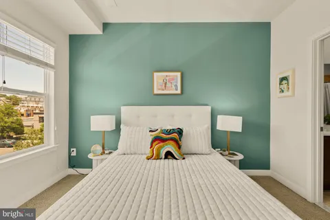 a view of a room with a white walls