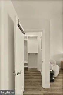 a view of staircase with white walls