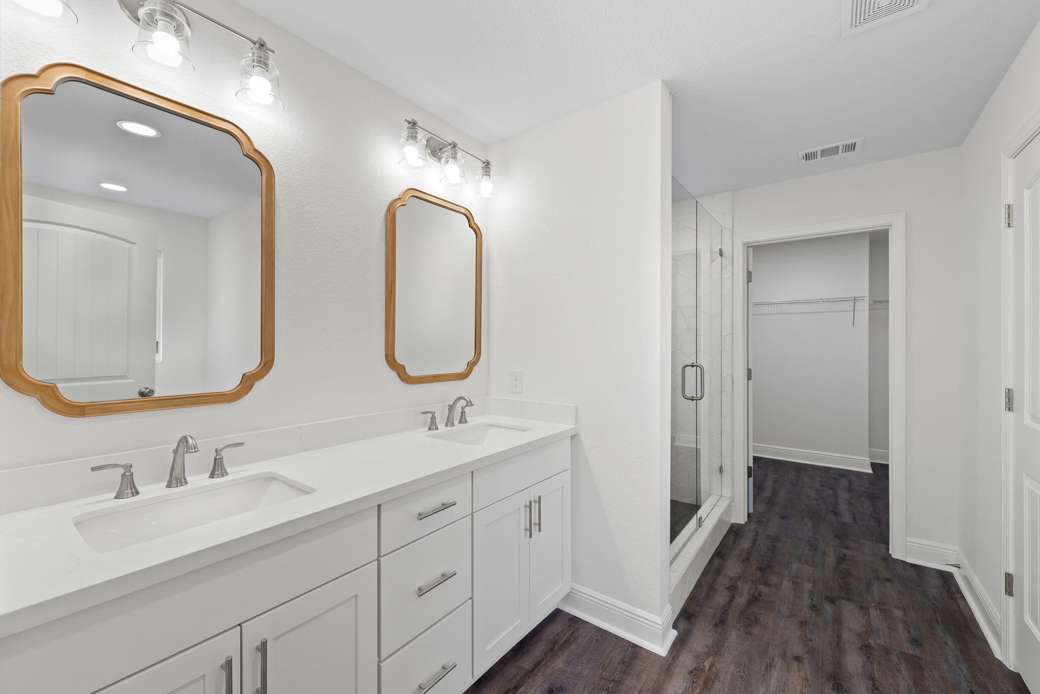 2399 Pineneedle Drive Navarre, FL 32566 - Photo 6 of 8 a en suite bathroom with a double vanity sink double and a mirror