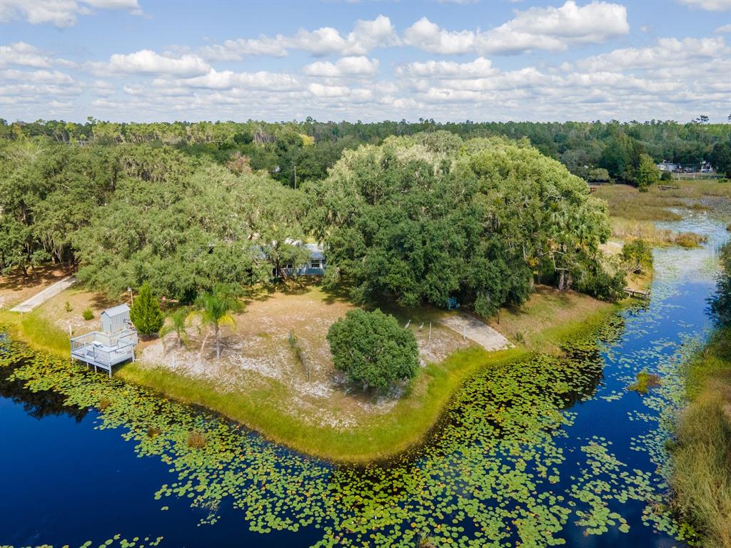a view of a lake with a yard