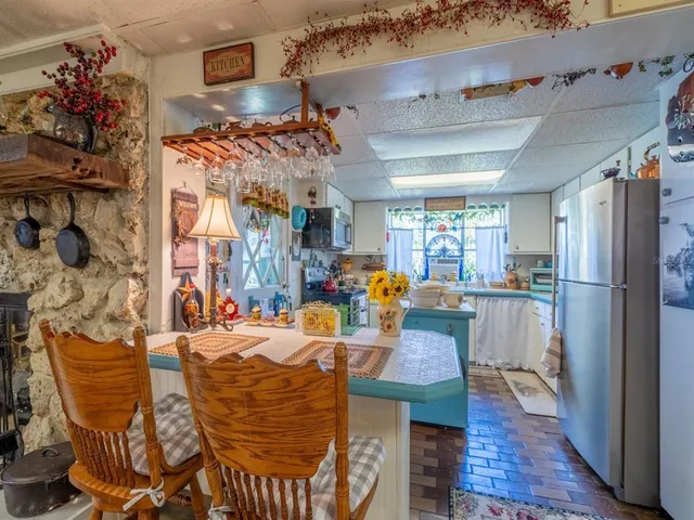 a view of a swimming pool with an outdoor space and seating area