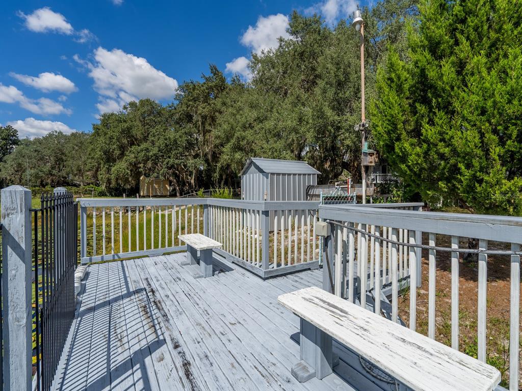 23560 Northeast 154th Place Road Salt Springs, FL 32134 - Photo 25 of 52 a balcony with view of trees in the background