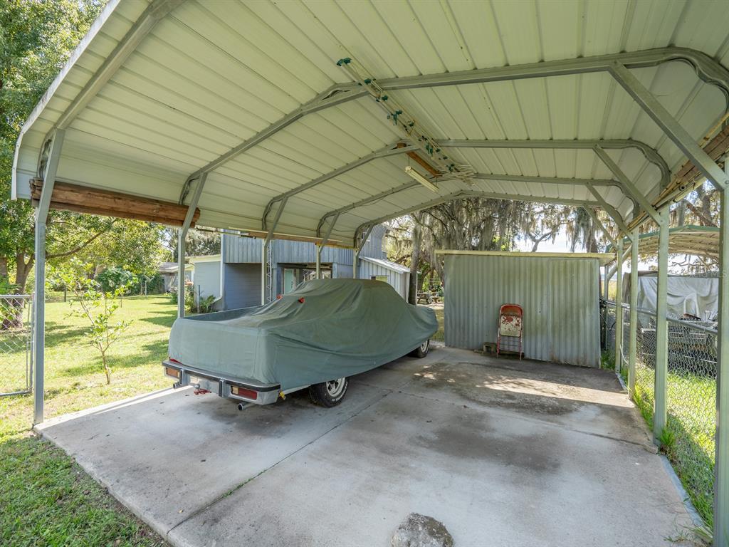 23560 Northeast 154th Place Road Salt Springs, FL 32134 - Photo 36 of 52 a view of a room with wooden walls and a roof deck