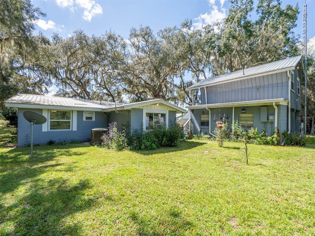 23560 Northeast 154th Place Road Salt Springs, FL 32134 - Photo 4 of 52 a front view of house with yard and green space