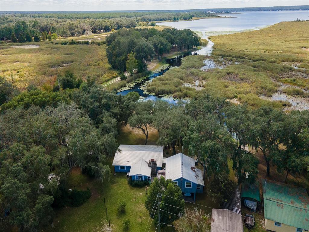 23560 Northeast 154th Place Road Salt Springs, FL 32134 - Photo 45 of 52 an aerial view of a house with garden space and ocean view
