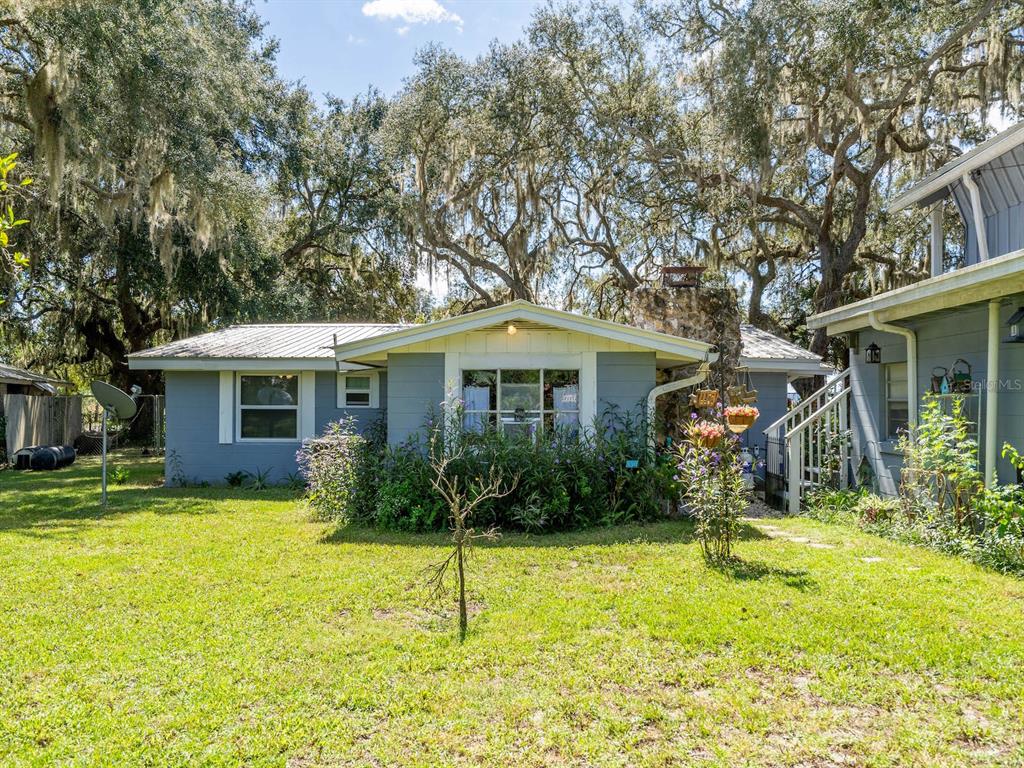 23560 Northeast 154th Place Road Salt Springs, FL 32134 - Photo 5 of 52 a view of a house with backyard and sitting area