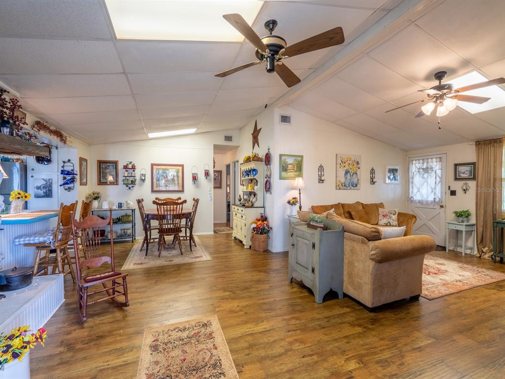 23560 Northeast 154th Place Road Salt Springs, FL 32134 - Photo 7 of 52 a living room with furniture and wooden floor