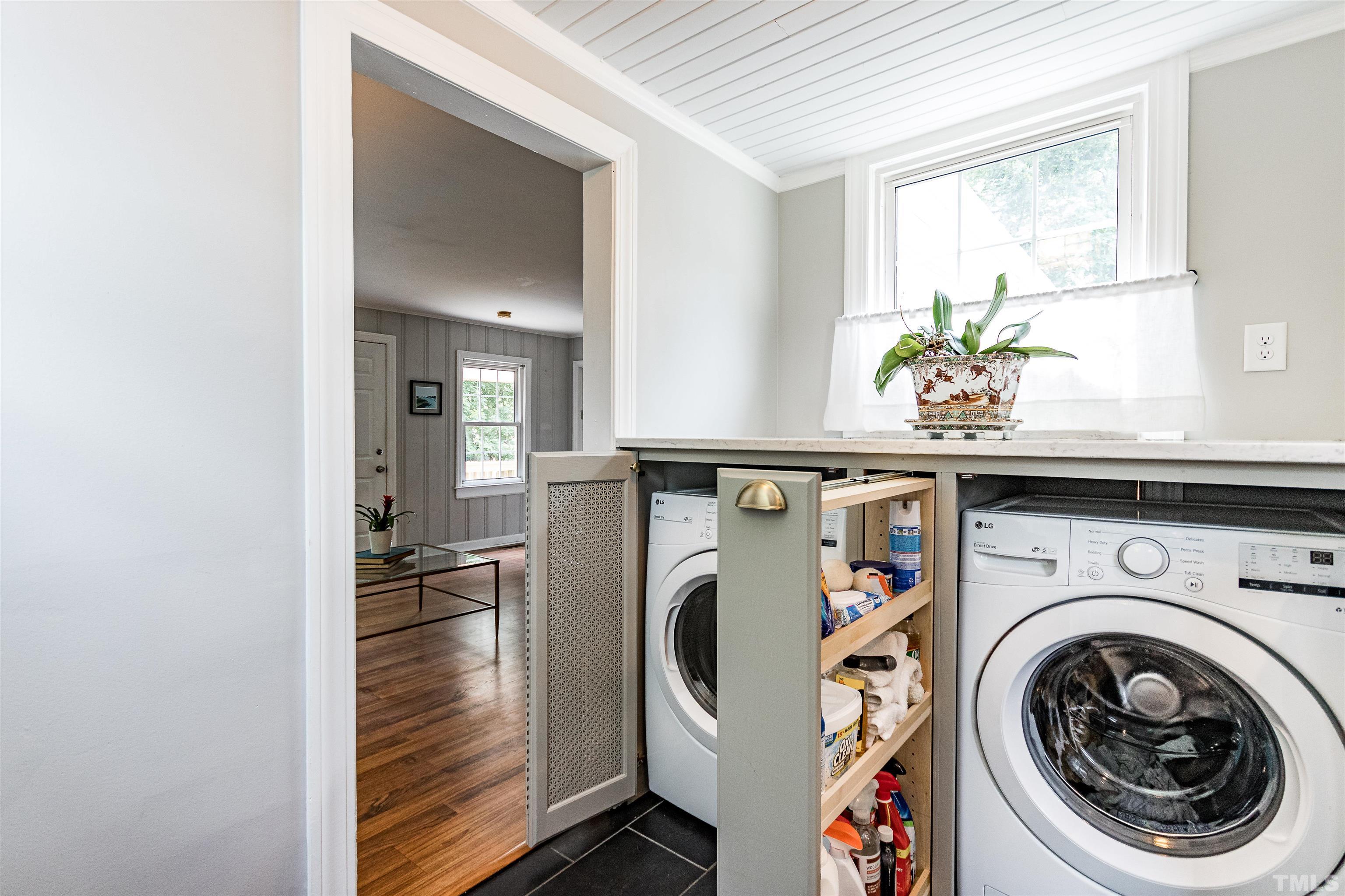758 East Whitaker Mill Road Raleigh, NC 27608 - Photo 22 of 43 a utility room with sink dryer and washer