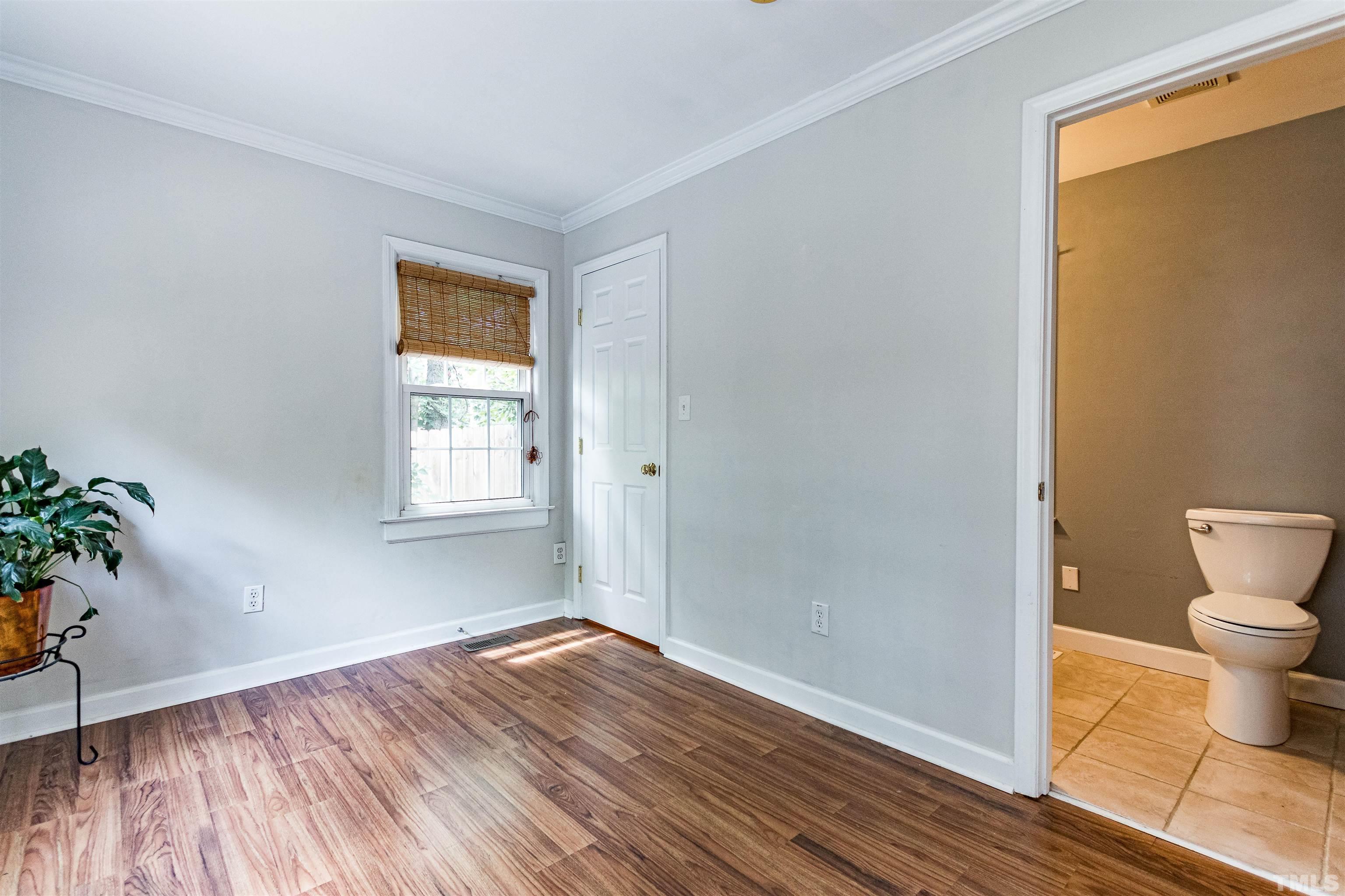 758 East Whitaker Mill Road Raleigh, NC 27608 - Photo 29 of 43 a bathroom with a sink and a toilet