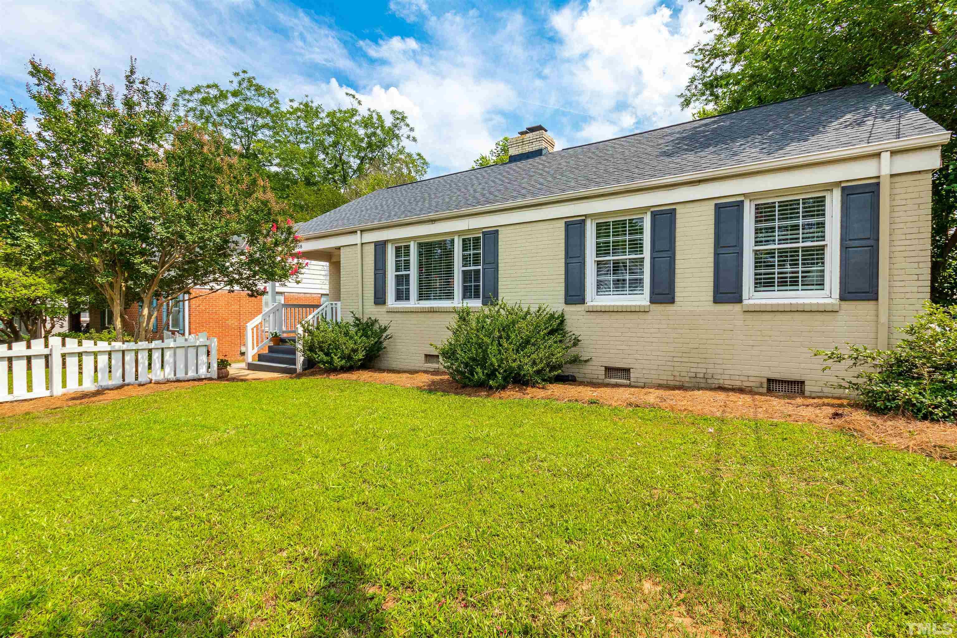 758 East Whitaker Mill Road Raleigh, NC 27608 - Photo 3 of 43 a front view of a house with garden