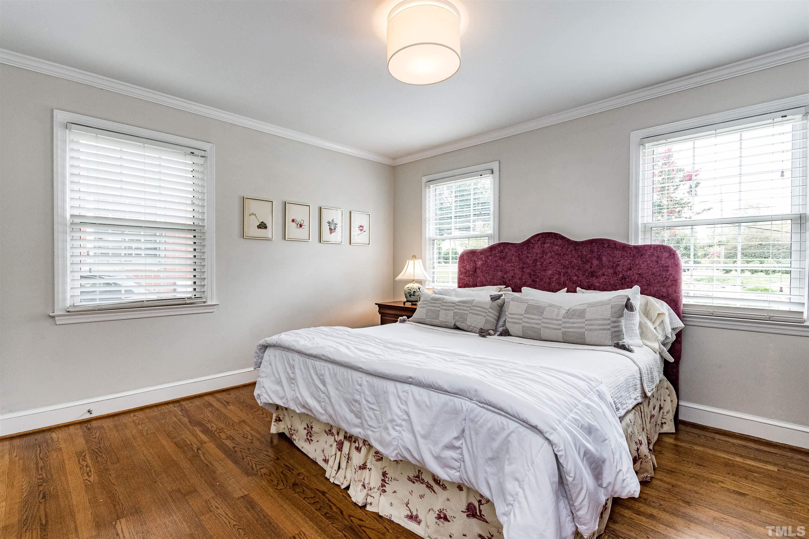 758 East Whitaker Mill Road Raleigh, NC 27608 - Photo 32 of 43 a bedroom with a bed and a window
