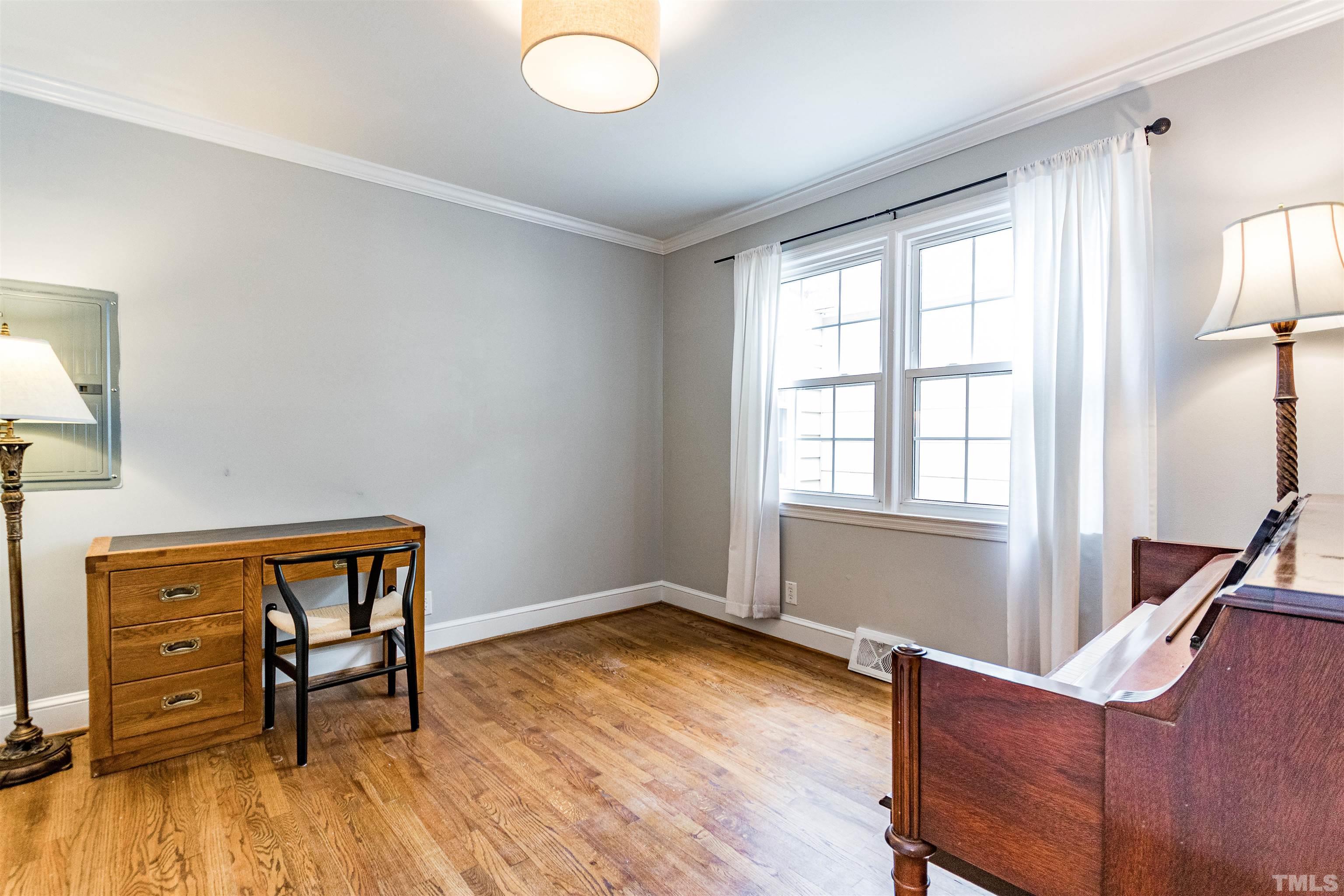 758 East Whitaker Mill Road Raleigh, NC 27608 - Photo 36 of 43 a view of a livingroom with furniture and wooden floor