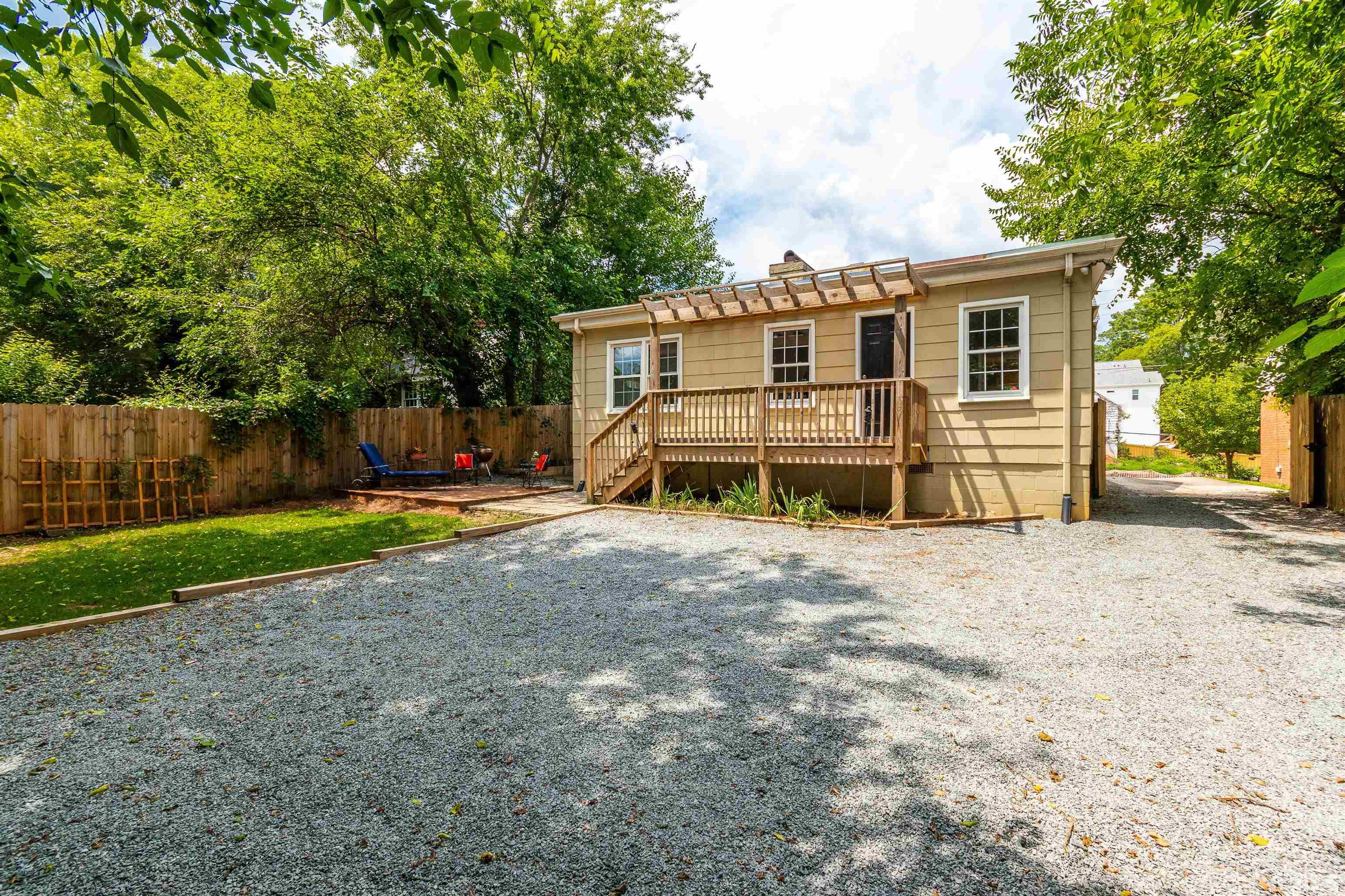 758 East Whitaker Mill Road Raleigh, NC 27608 - Photo 40 of 43 a front view of a house with a yard and garage