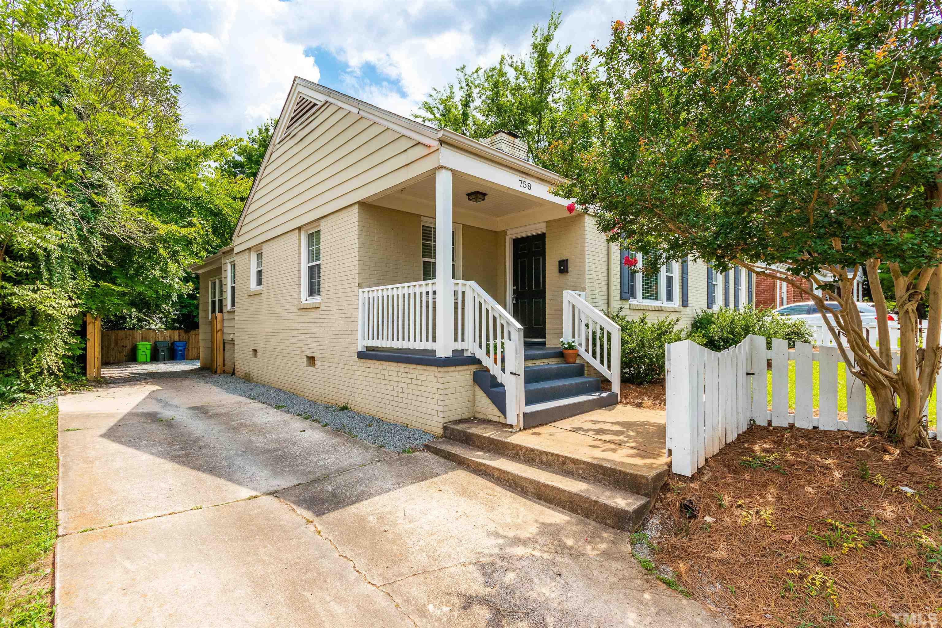 758 East Whitaker Mill Road Raleigh, NC 27608 - Photo 4 of 43 a view of a house with a yard and plants