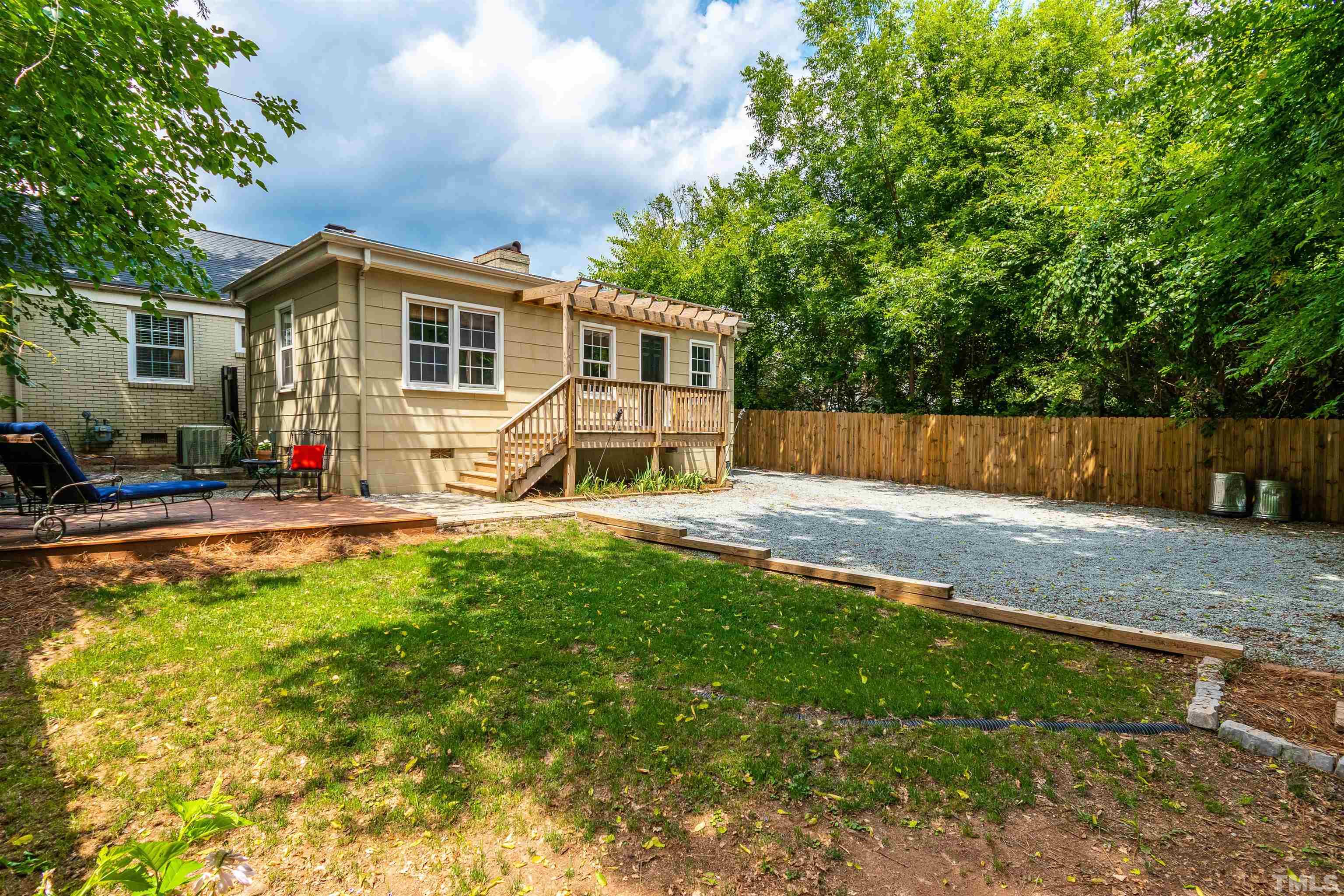 758 East Whitaker Mill Road Raleigh, NC 27608 - Photo 41 of 43 a view of a house with backyard and sitting area