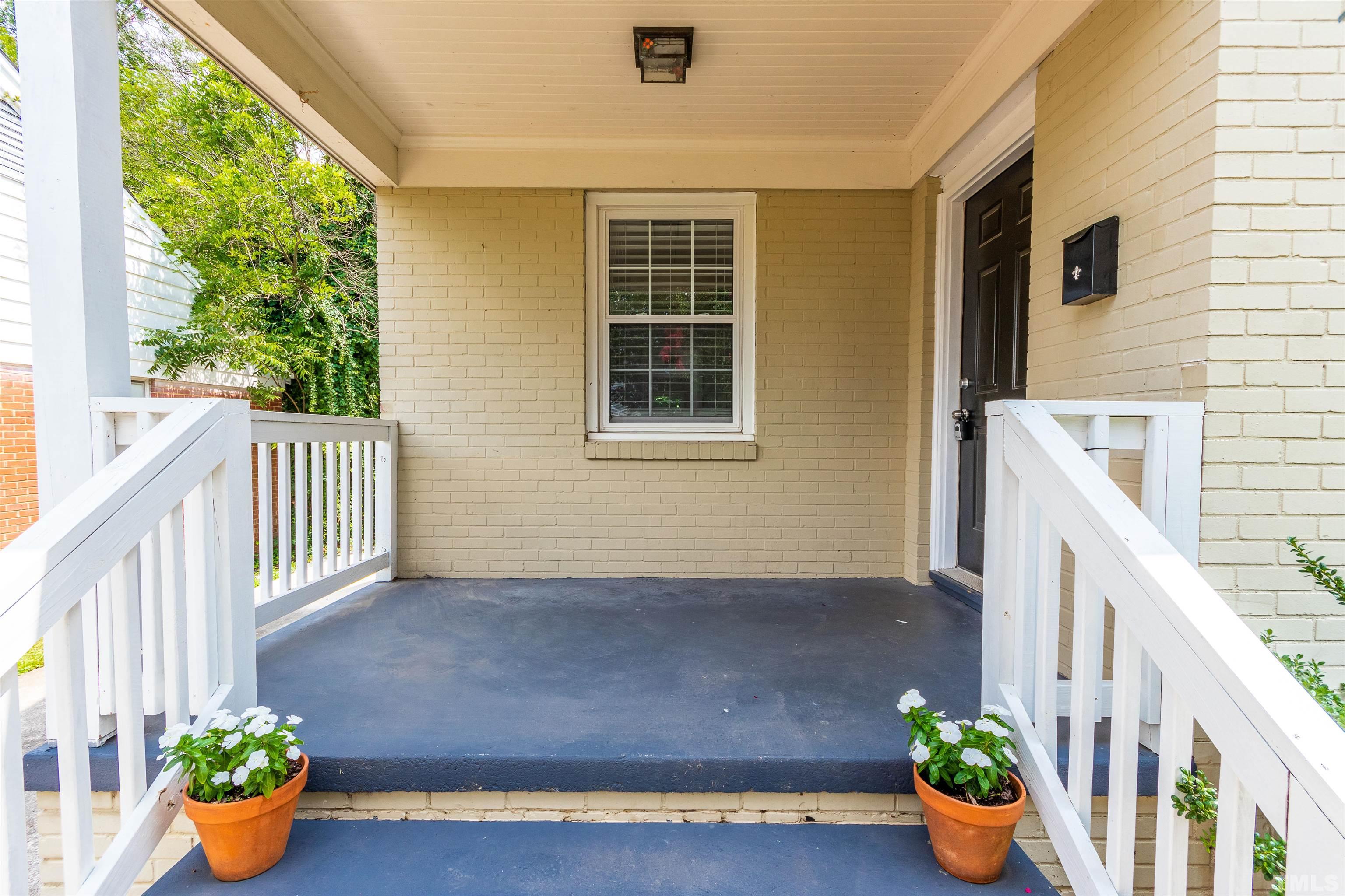 758 East Whitaker Mill Road Raleigh, NC 27608 - Photo 5 of 43 a front view of a house with patio