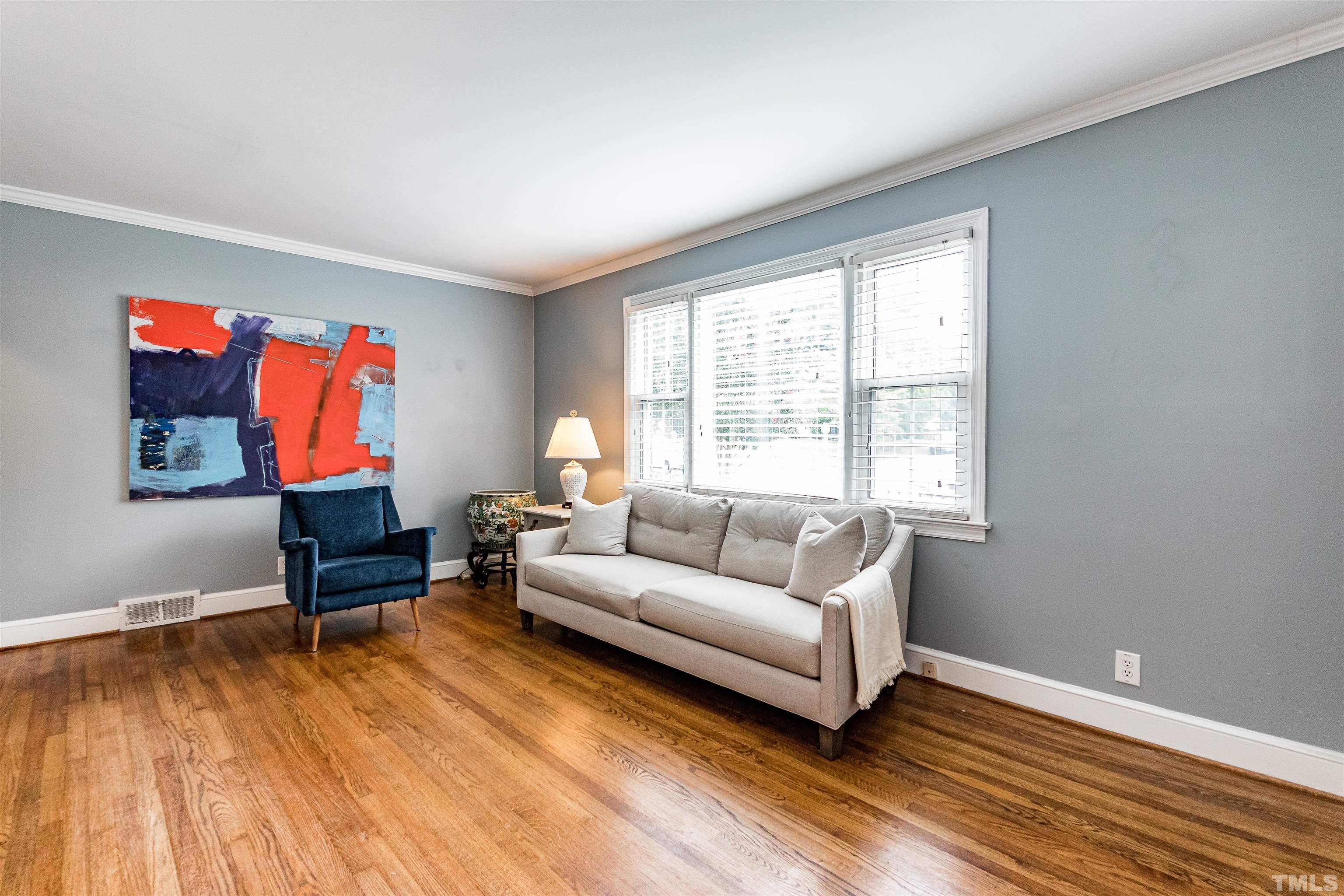 758 East Whitaker Mill Road Raleigh, NC 27608 - Photo 8 of 43 a living room with furniture a rug and a window