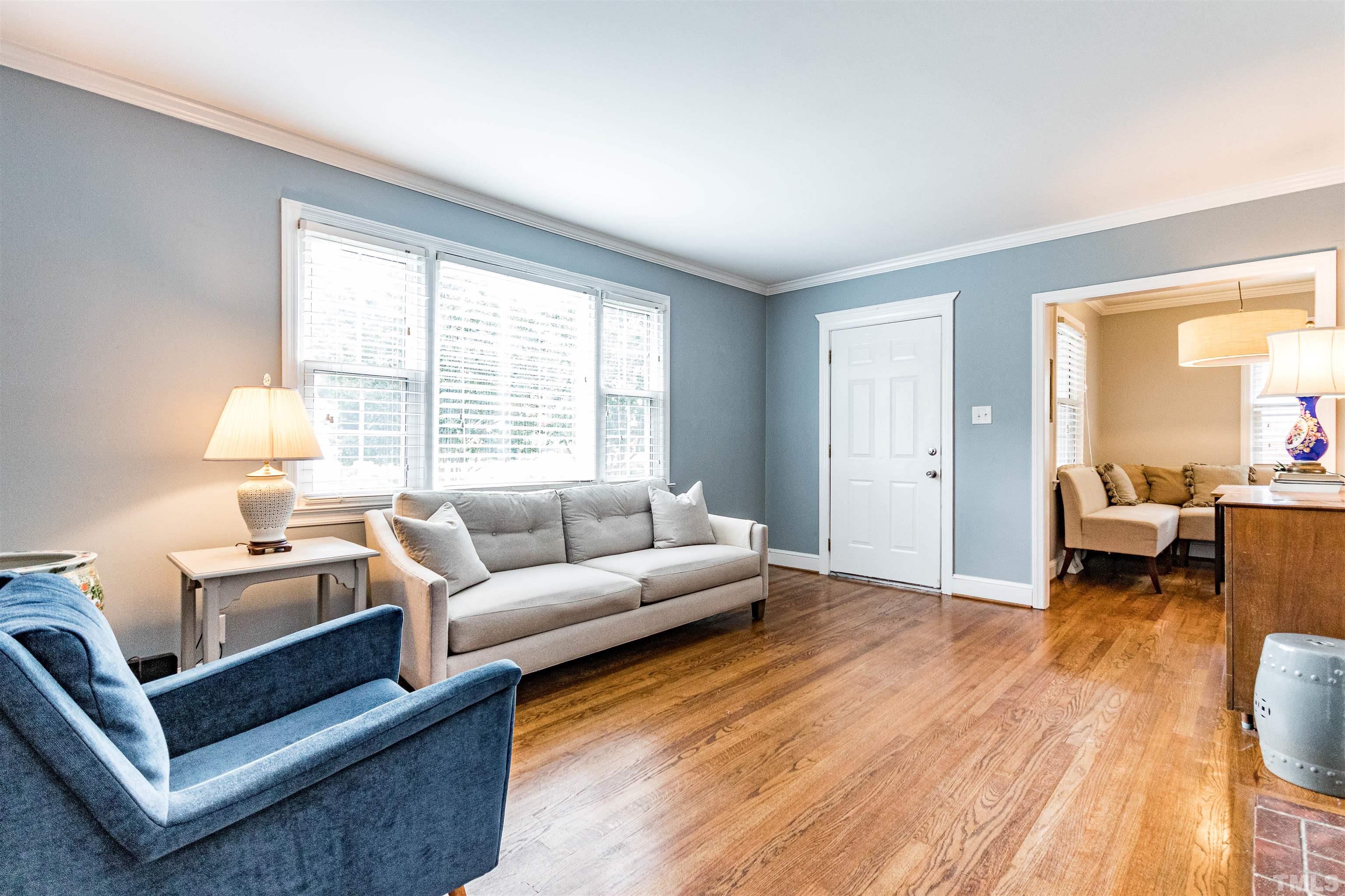 758 East Whitaker Mill Road Raleigh, NC 27608 - Photo 9 of 43 a living room with furniture and a large window