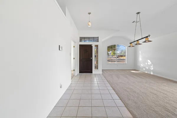 a kitchen with stainless steel appliances kitchen island granite countertop a stove a sink and a microwave