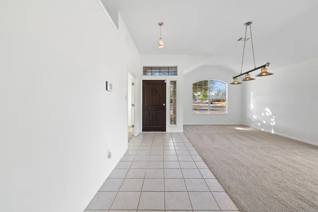 a kitchen with stainless steel appliances kitchen island granite countertop a stove a sink and a microwave