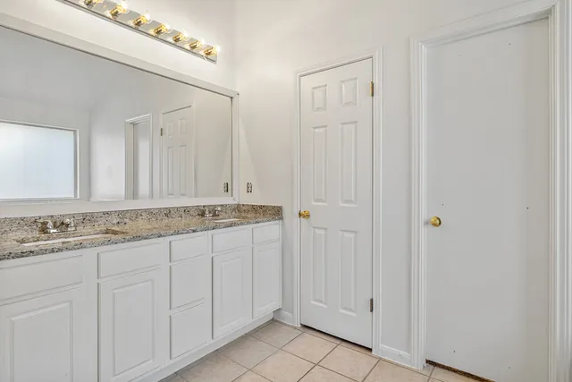 a bathroom with a shower and a glass door