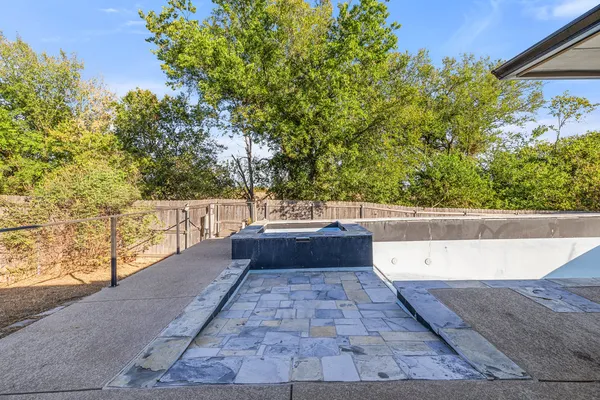 a house view with a backyard space