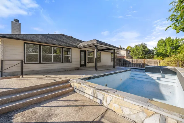 a view of balcony with two potted plants