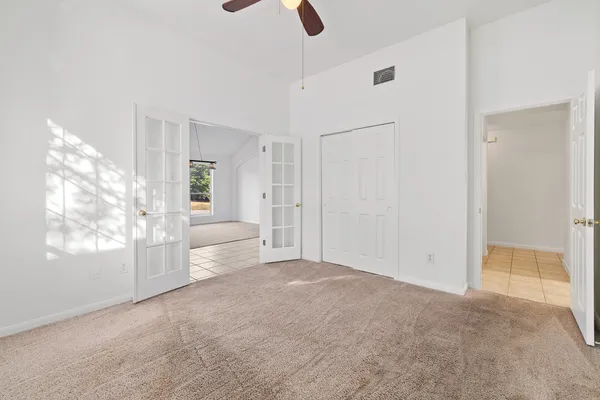a view of an empty room with a window