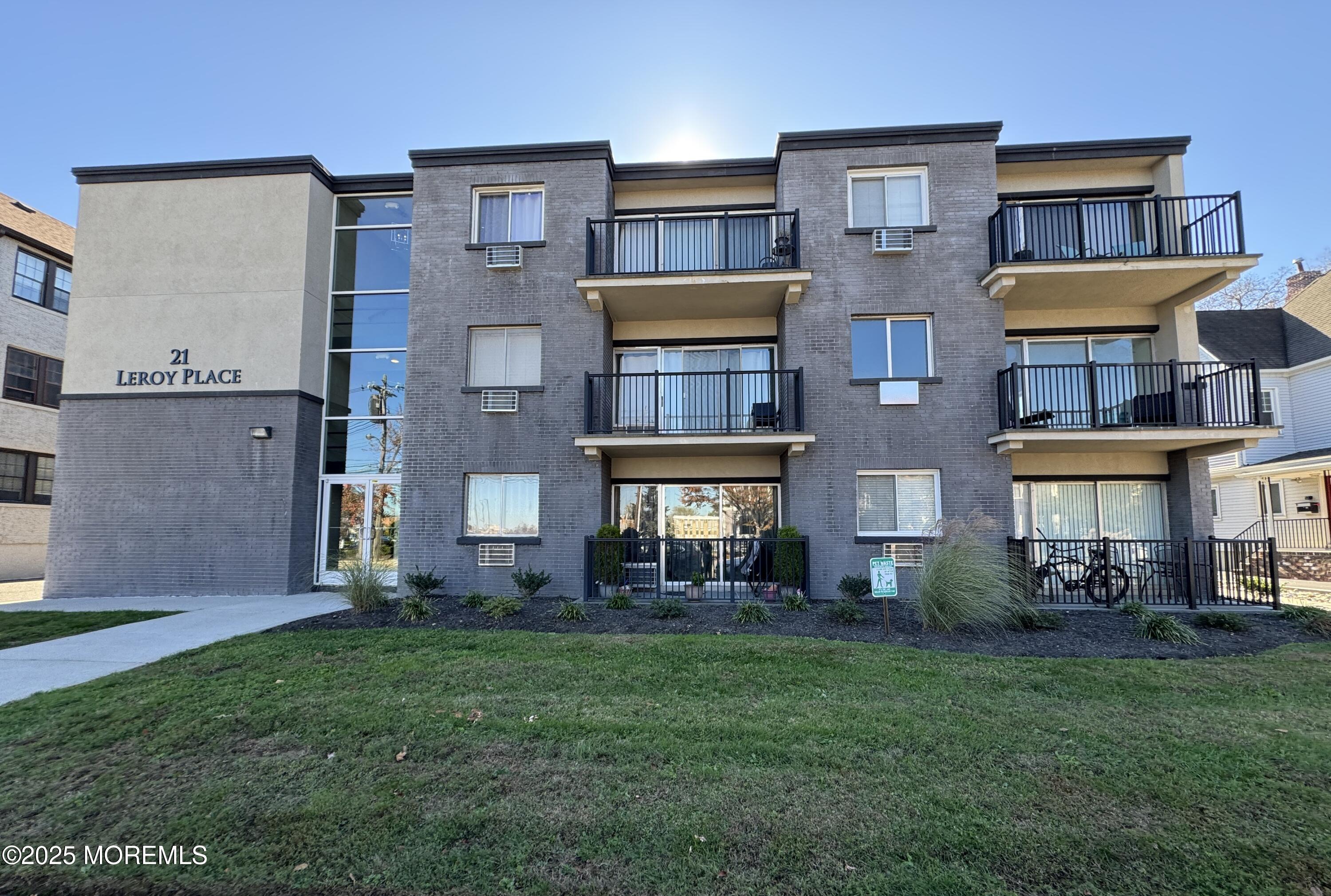21 Leroy Place, Unit 3F Red Bank, NJ 07701 - Photo 1 of 17 a front view of a house with a yard