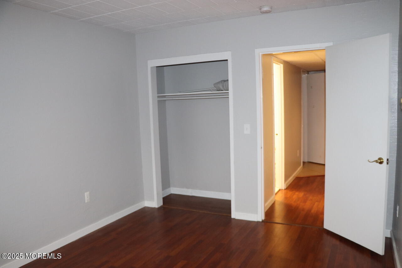 21 Leroy Place, Unit 3F Red Bank, NJ 07701 - Photo 13 of 17 an empty room with wooden floor and closet