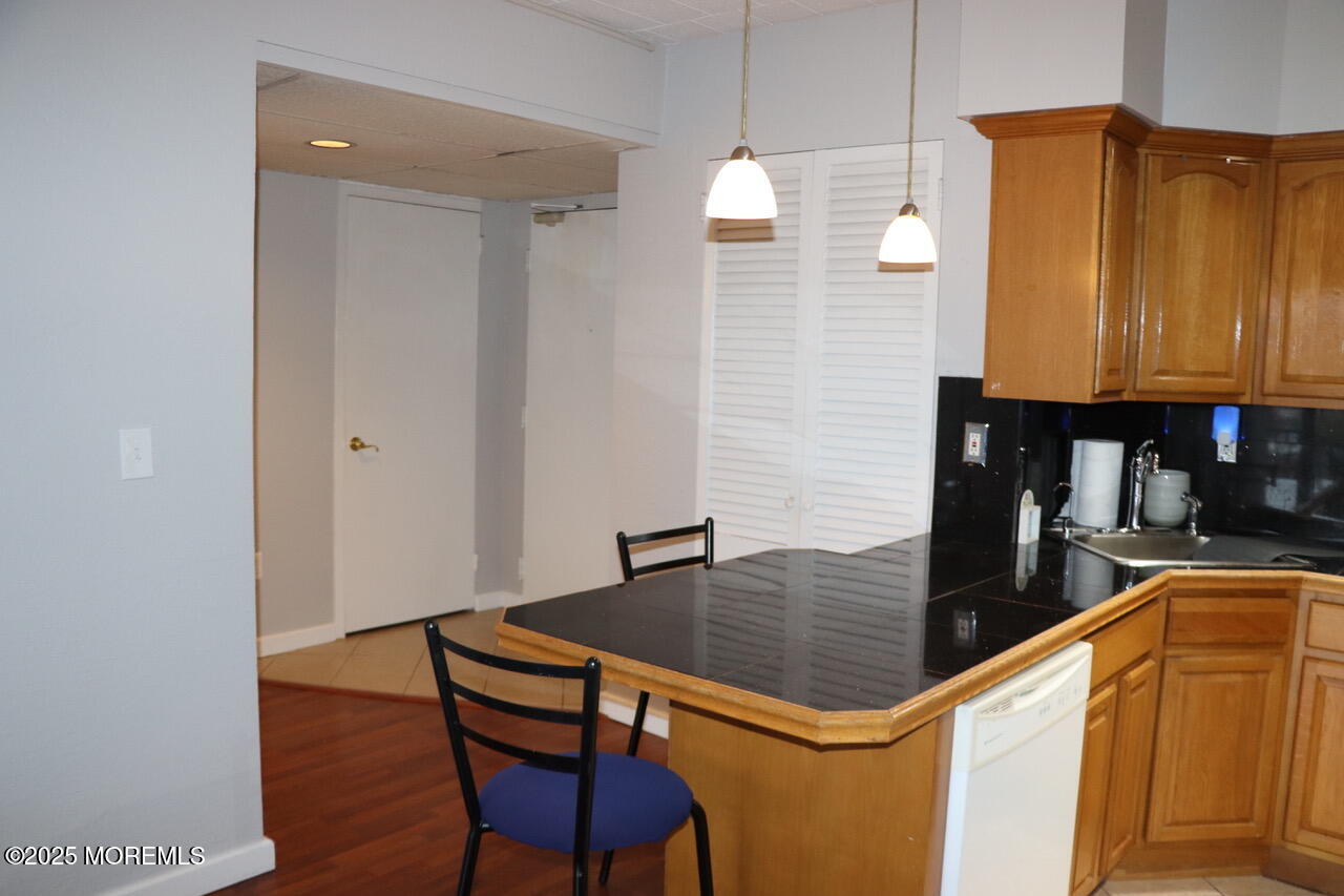 21 Leroy Place, Unit 3F Red Bank, NJ 07701 - Photo 4 of 17 a kitchen with a sink cabinets and wooden floor