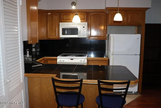 a kitchen with a stove and a microwave