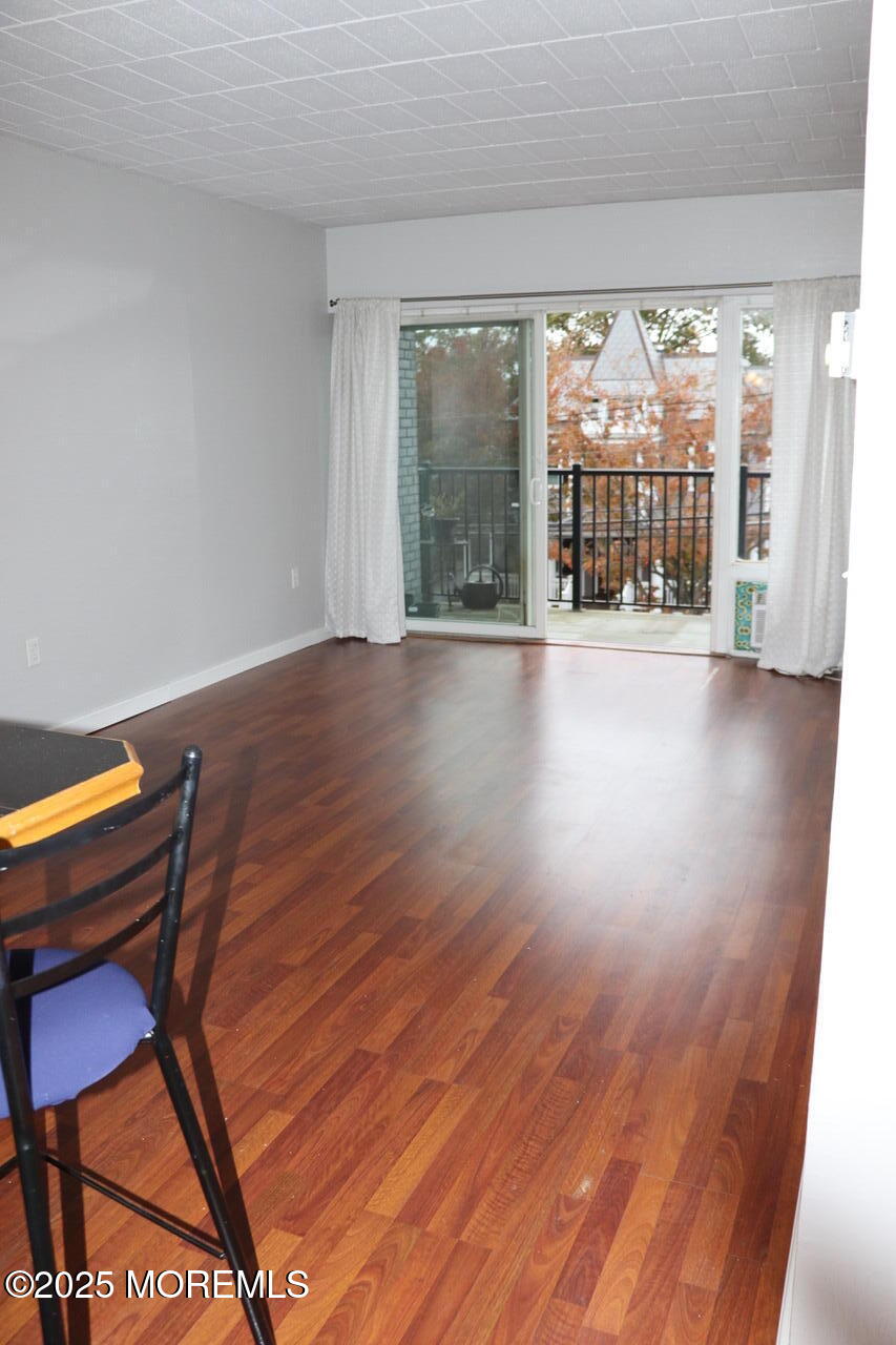 21 Leroy Place, Unit 3F Red Bank, NJ 07701 - Photo 8 of 17 a view of a room with furniture and wooden floor