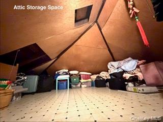 217-11 73rd Avenue, Unit 2 Queens, NY 11364 - Photo 15 of 21 a room with furniture and a flat screen tv