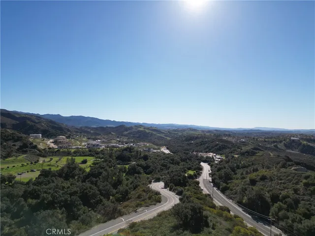 an aerial view of residential house and green space